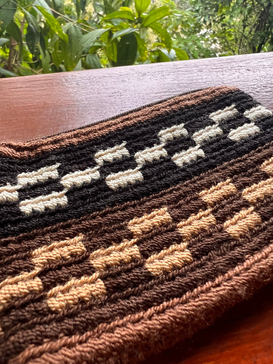 Brown Wayúu mini purse with beige black and white patterns