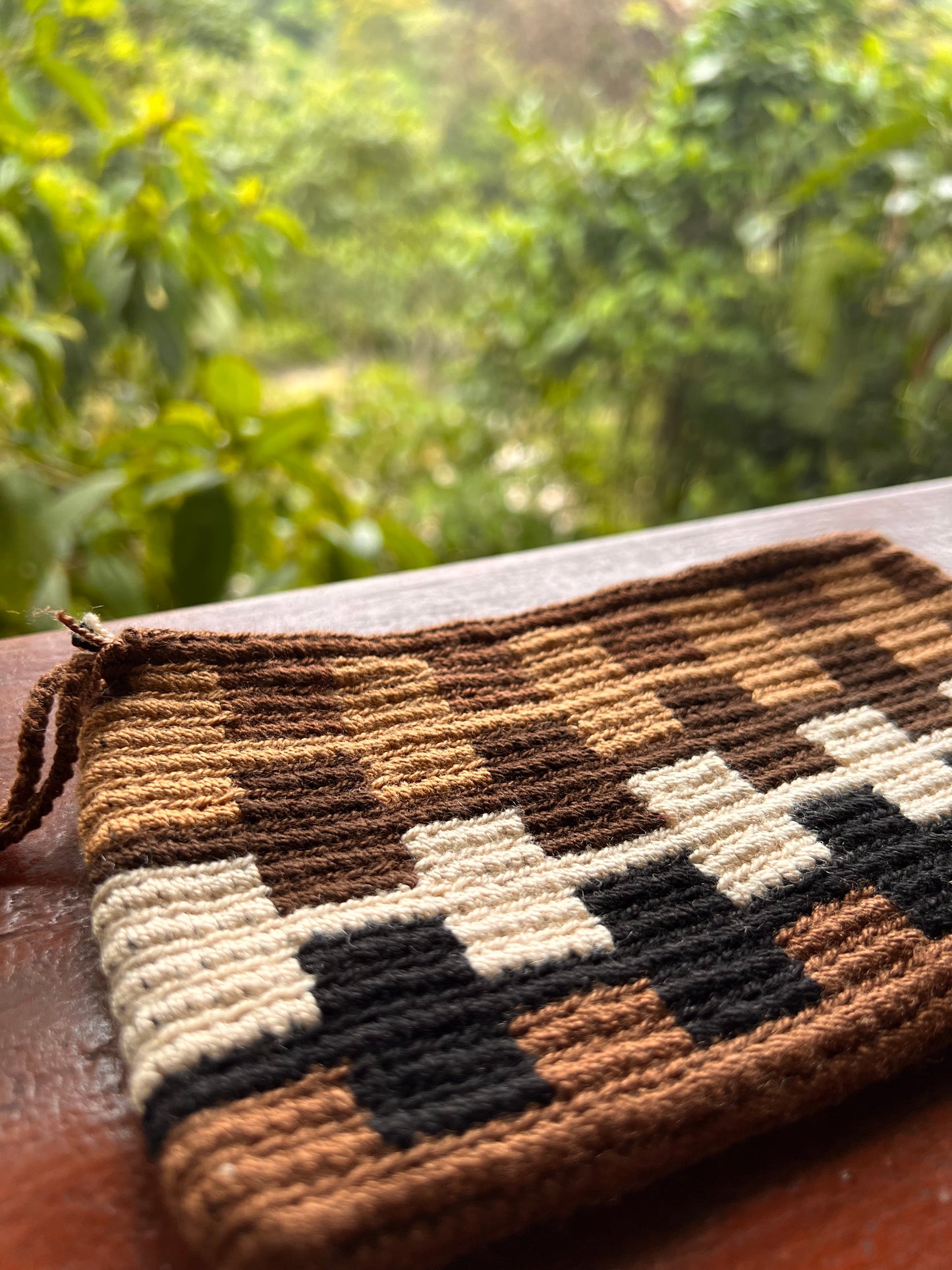 Brown Wayúu mini purse with white and black patterns