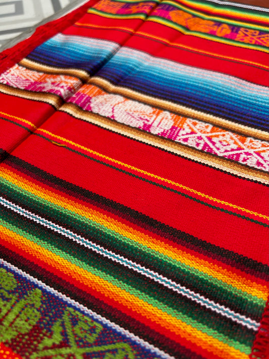 Red table cloth with multicolored patterns 25 x 160 cm