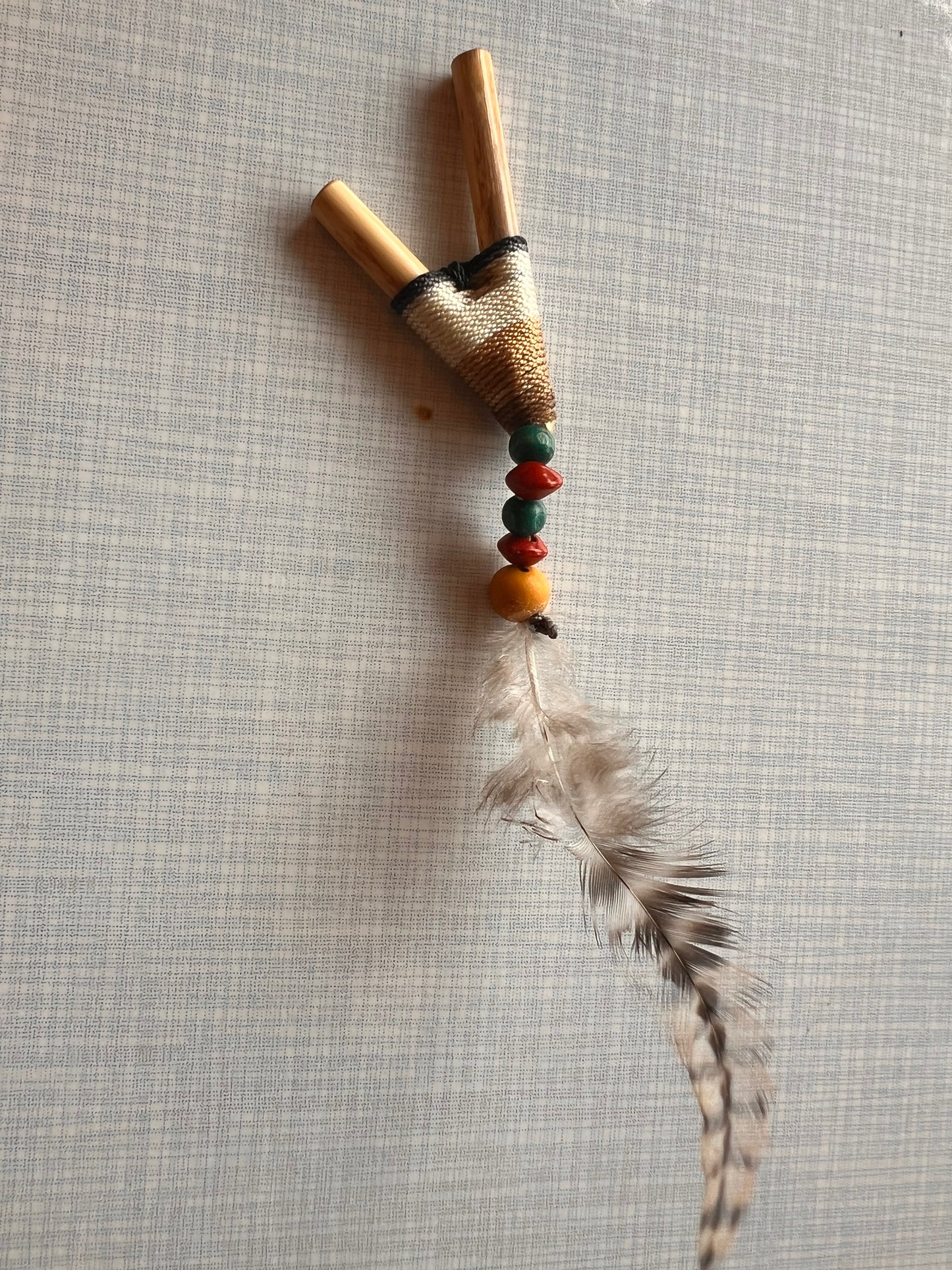 Beige-white Bamboo Kuripe with feather