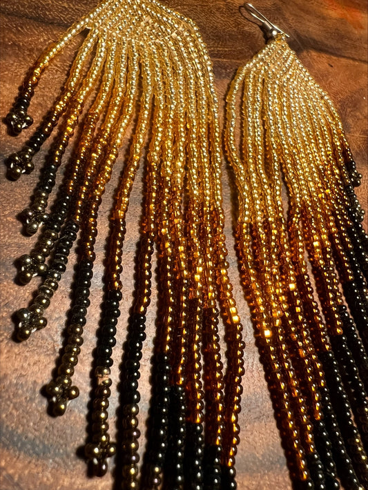 Long golden earth earrings