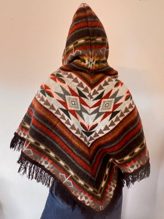 Small multicoloured poncho with patterns