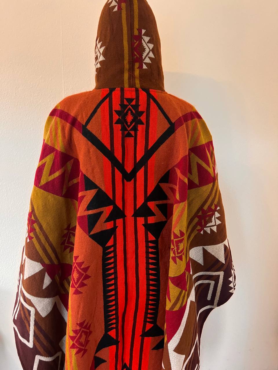 Red winter poncho with patterns