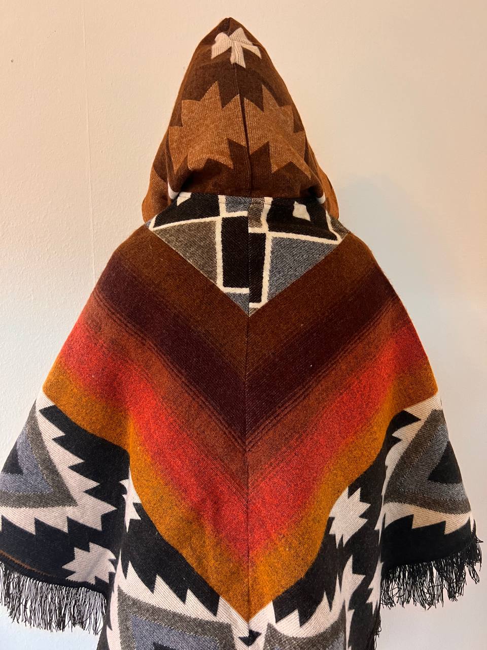 Earth tones winter poncho with patterns