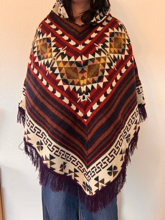 Brown winter poncho with red patterns