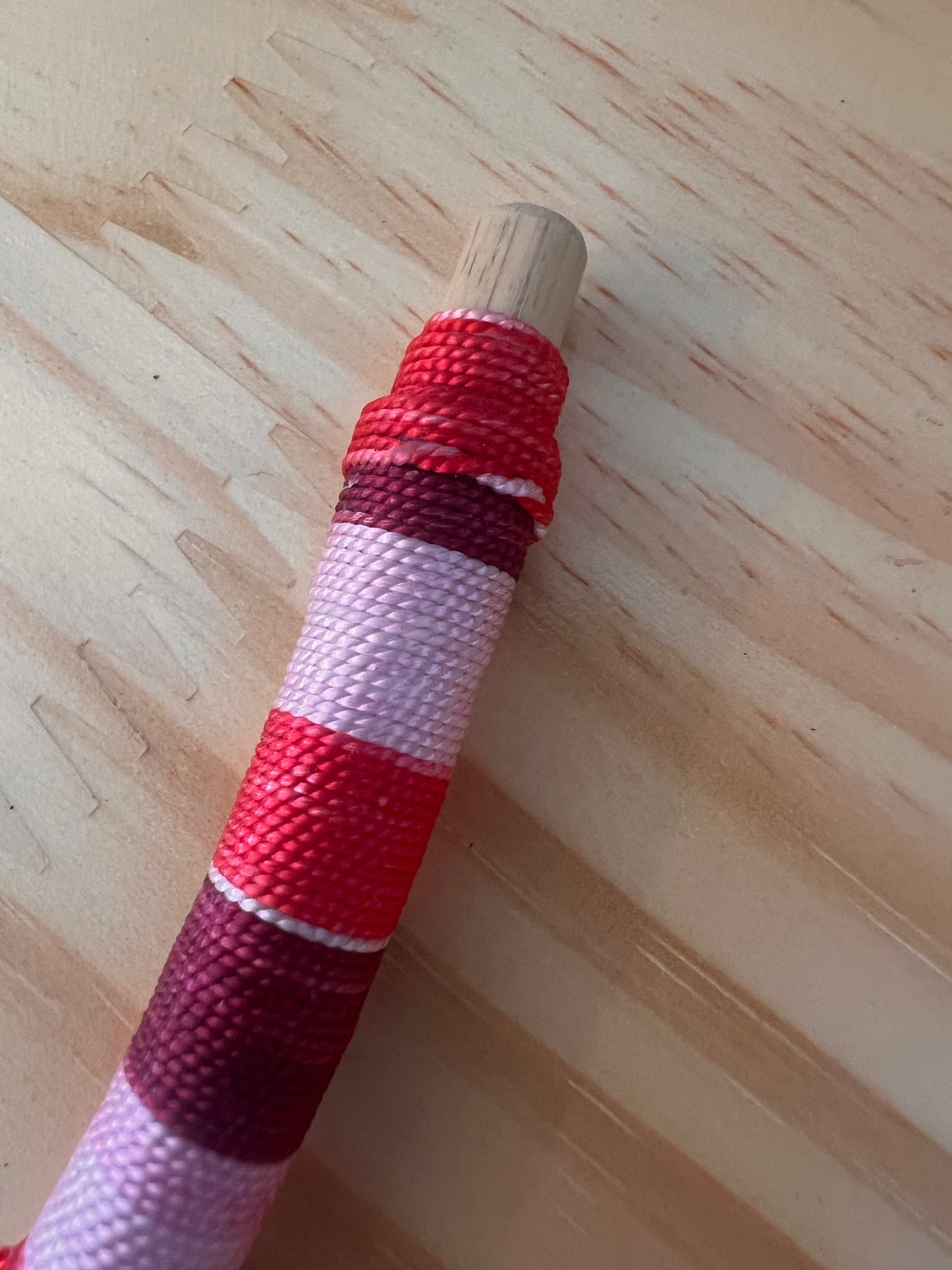 Red bendable Tepi with feather