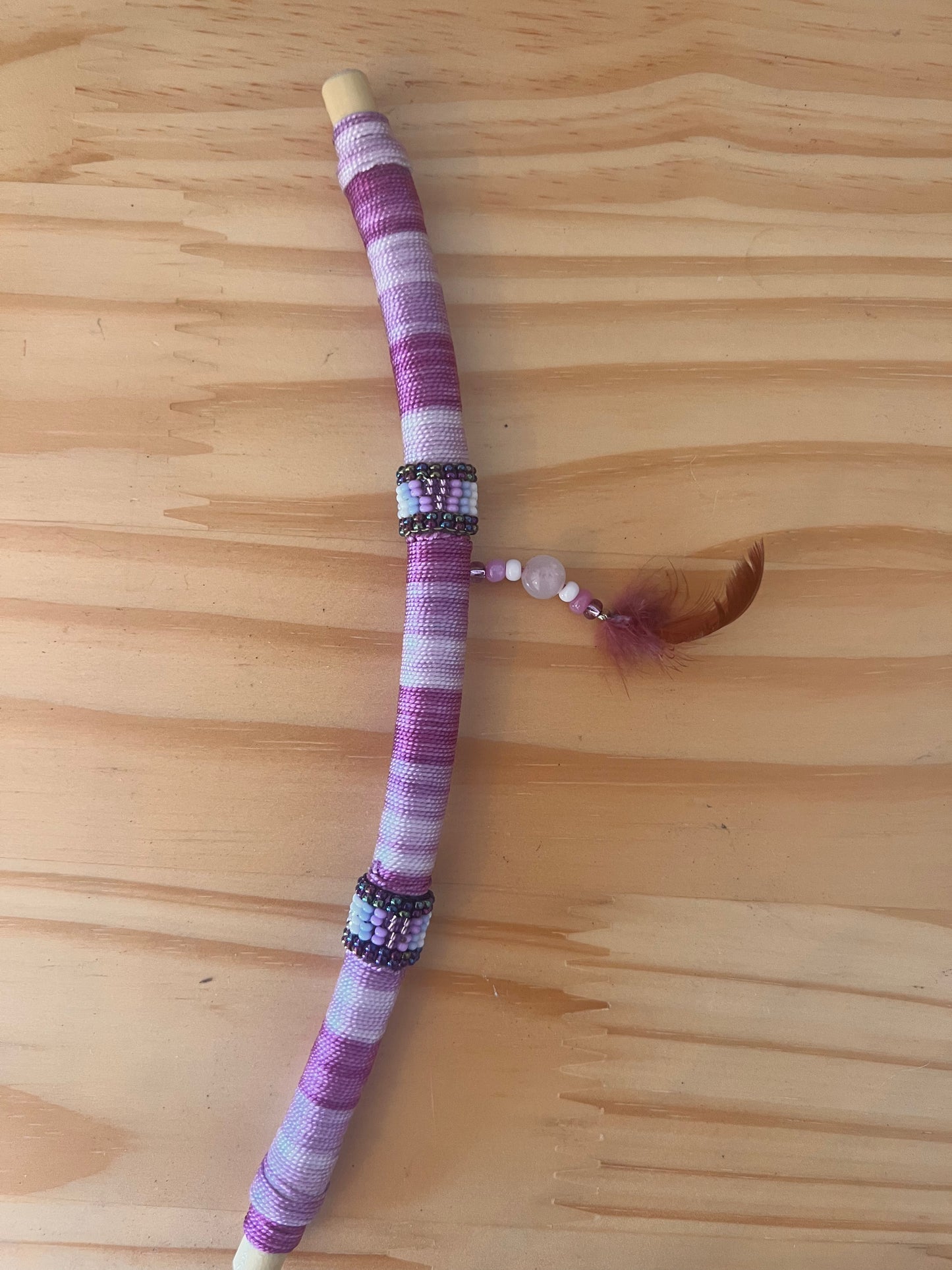 Purple bendable Tepi with feather