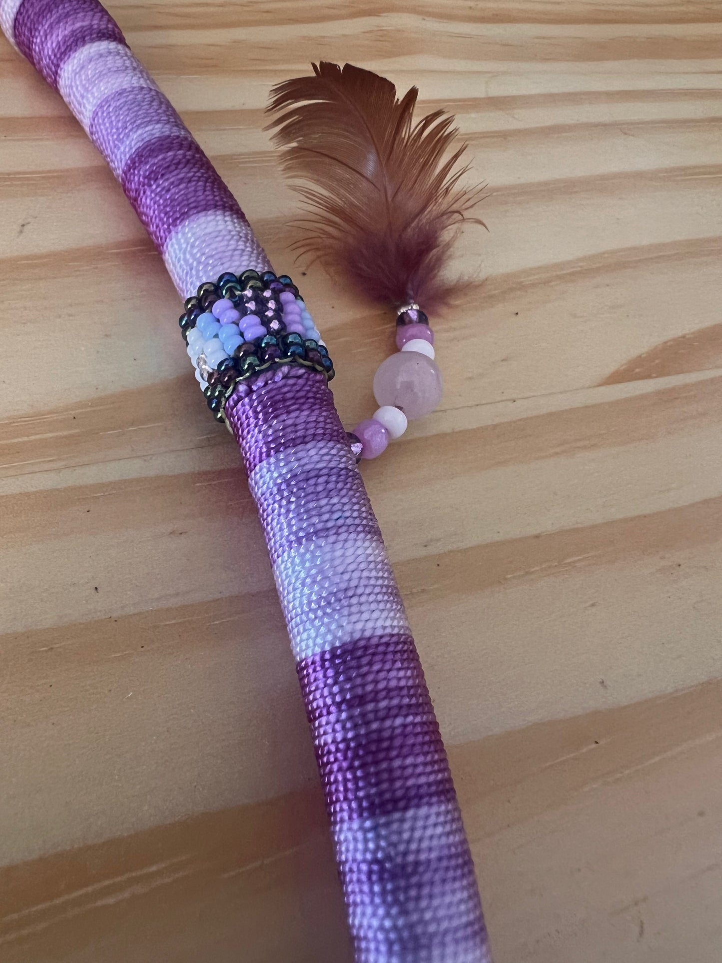 Purple bendable Tepi with feather