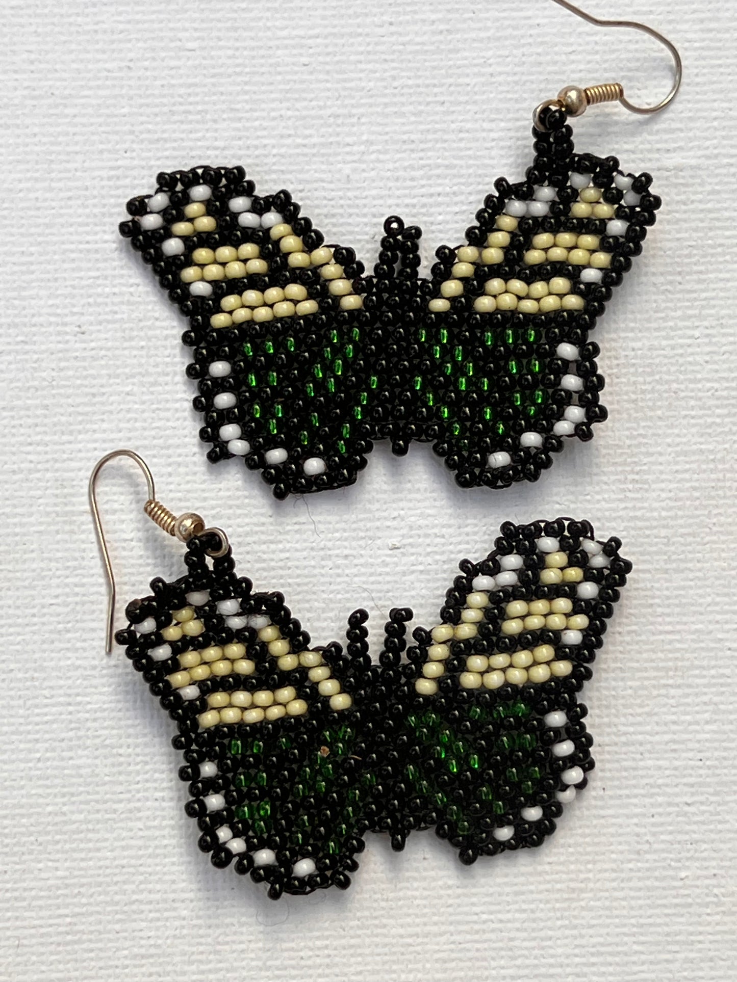 Butterfly earrings handmade by Mujer Araña (Yanacona)