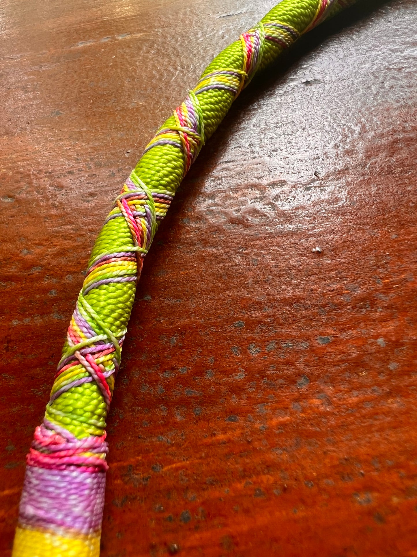 Light green bendable Bamboo Tepi with rainbow-colored patterns