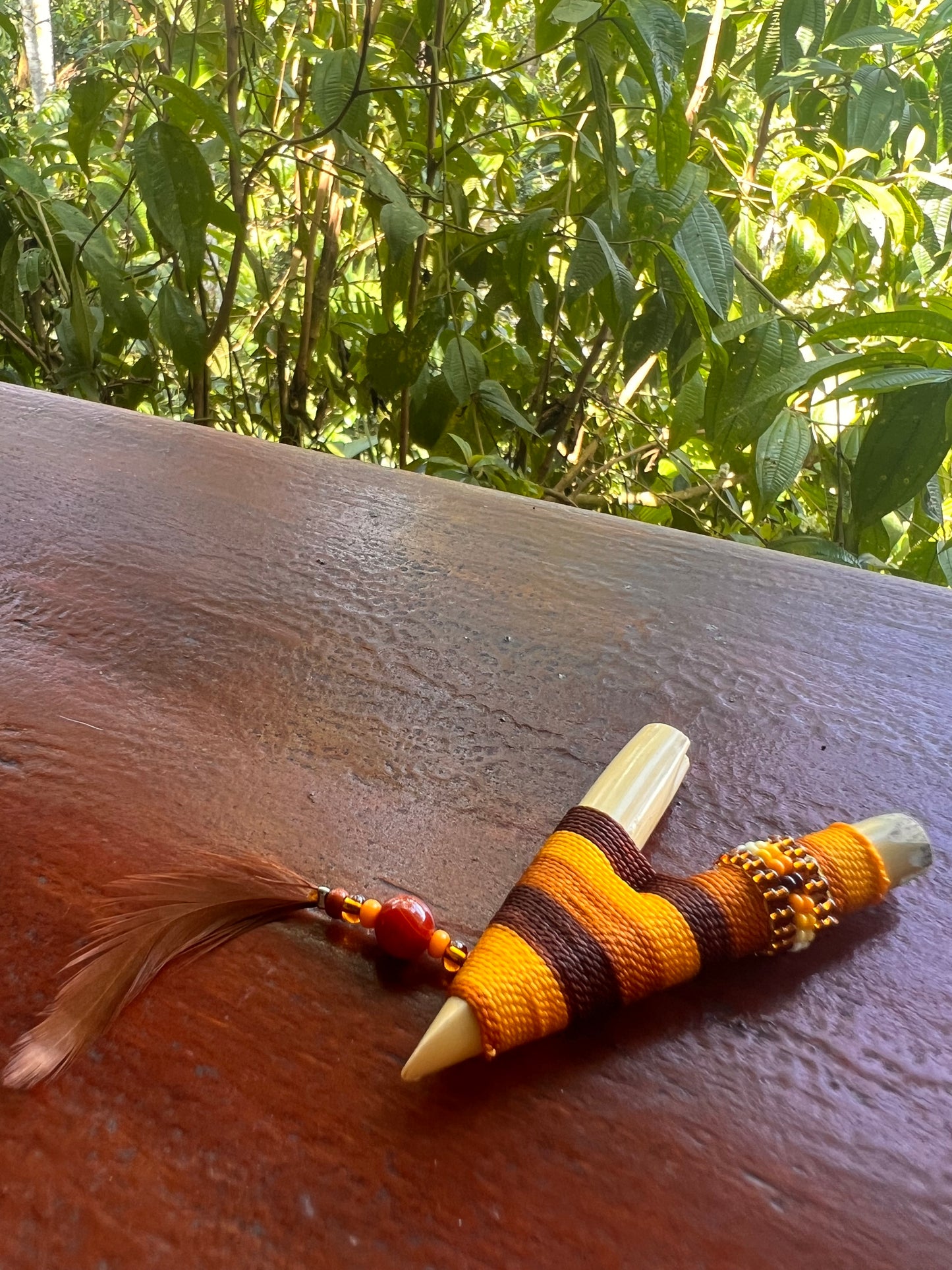 Brown-beige Bamboo Kuripe with feather and pearls