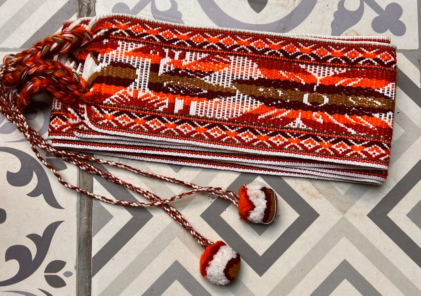 ceremony belt with white and brown patterns