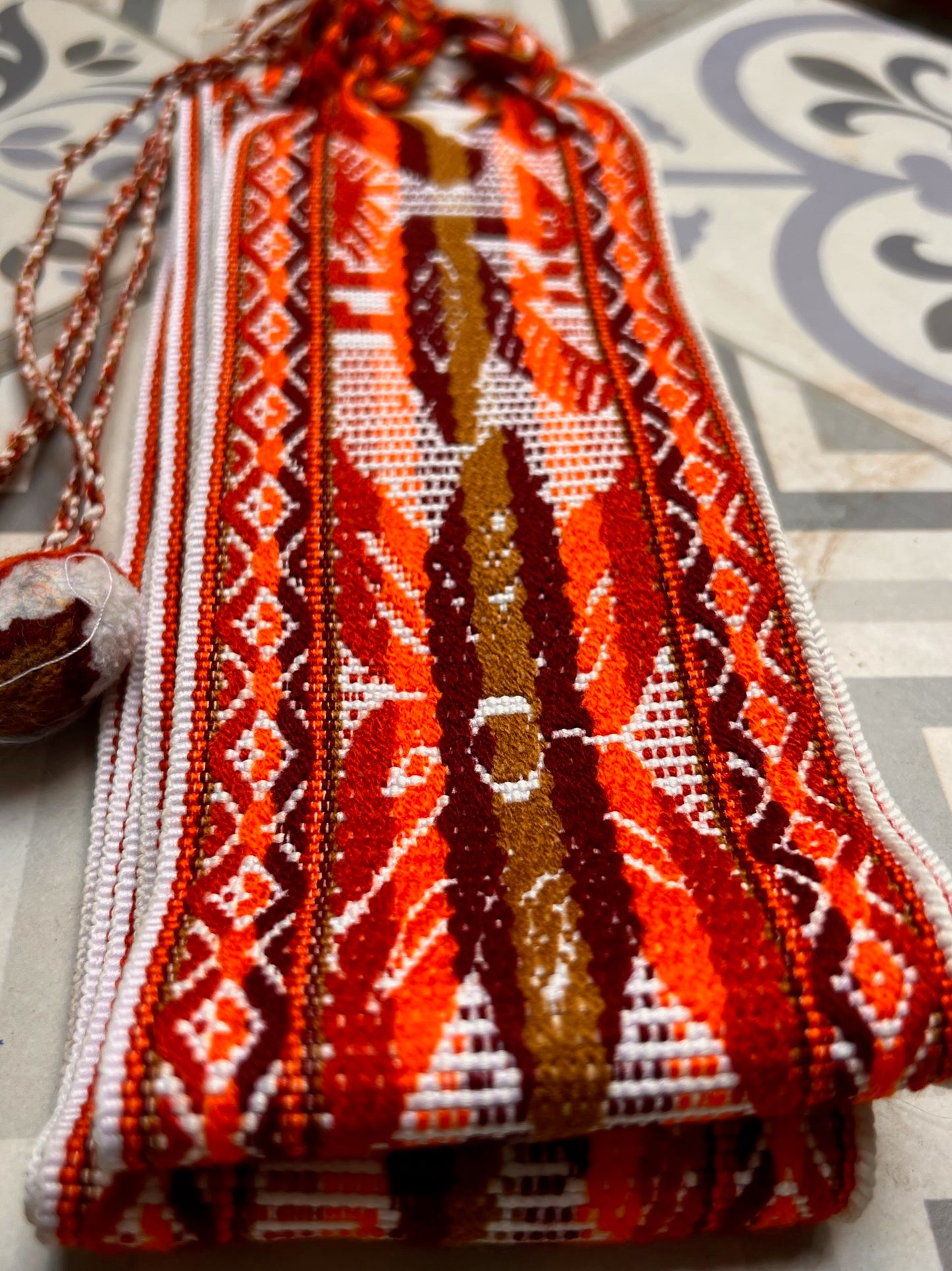 ceremony belt with white and brown patterns