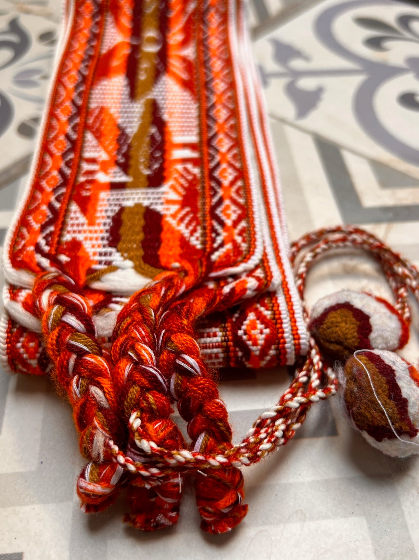 ceremony belt with white and brown patterns