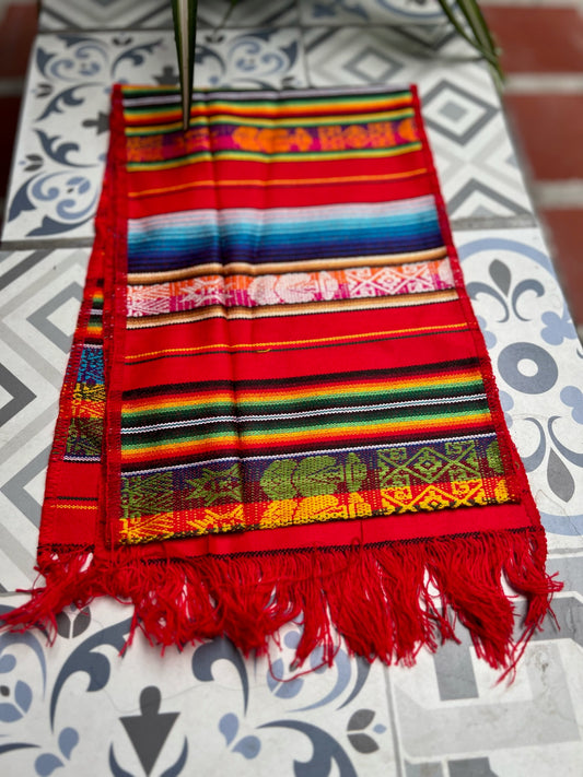 Red table cloth with multicolored patterns 25 x 160 cm