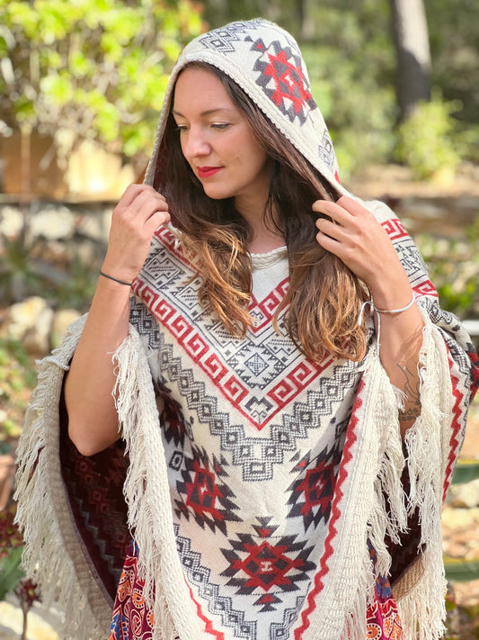 White winter poncho with red/grey patterns