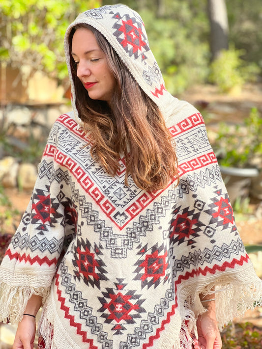 White winter poncho with red/grey patterns