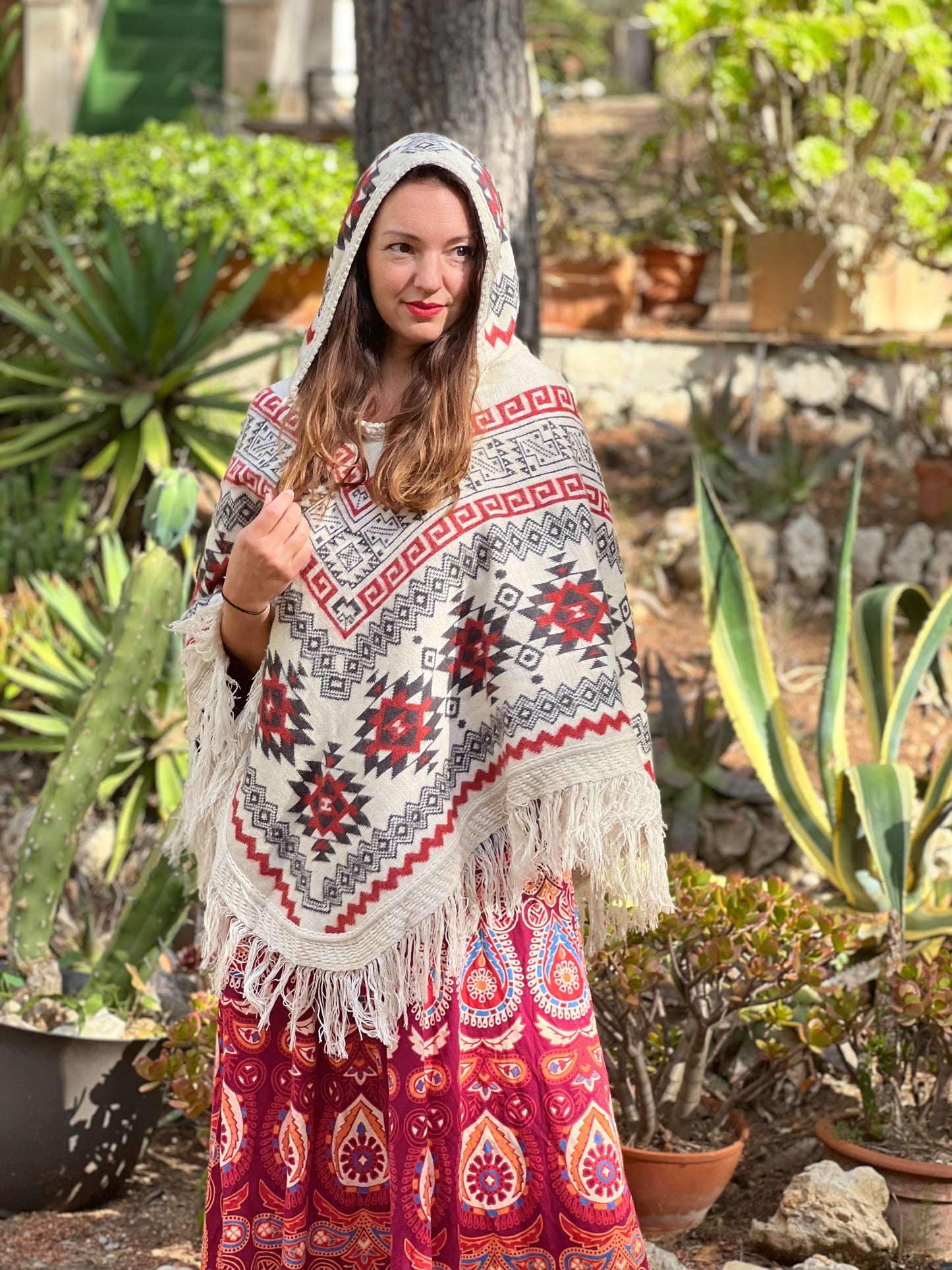 White winter poncho with red/grey patterns