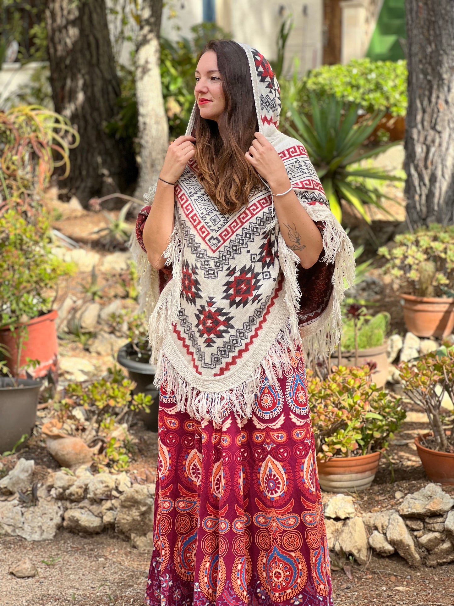 White winter poncho with red/grey patterns