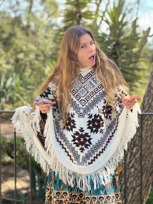 White winter poncho with brown patterns