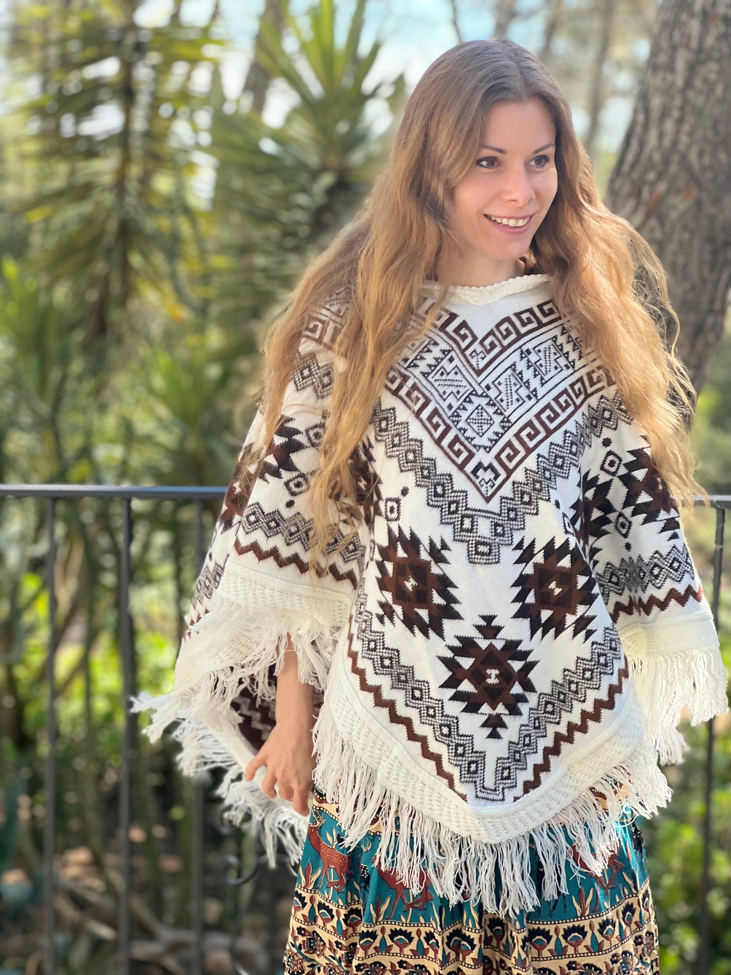 White winter poncho with brown patterns