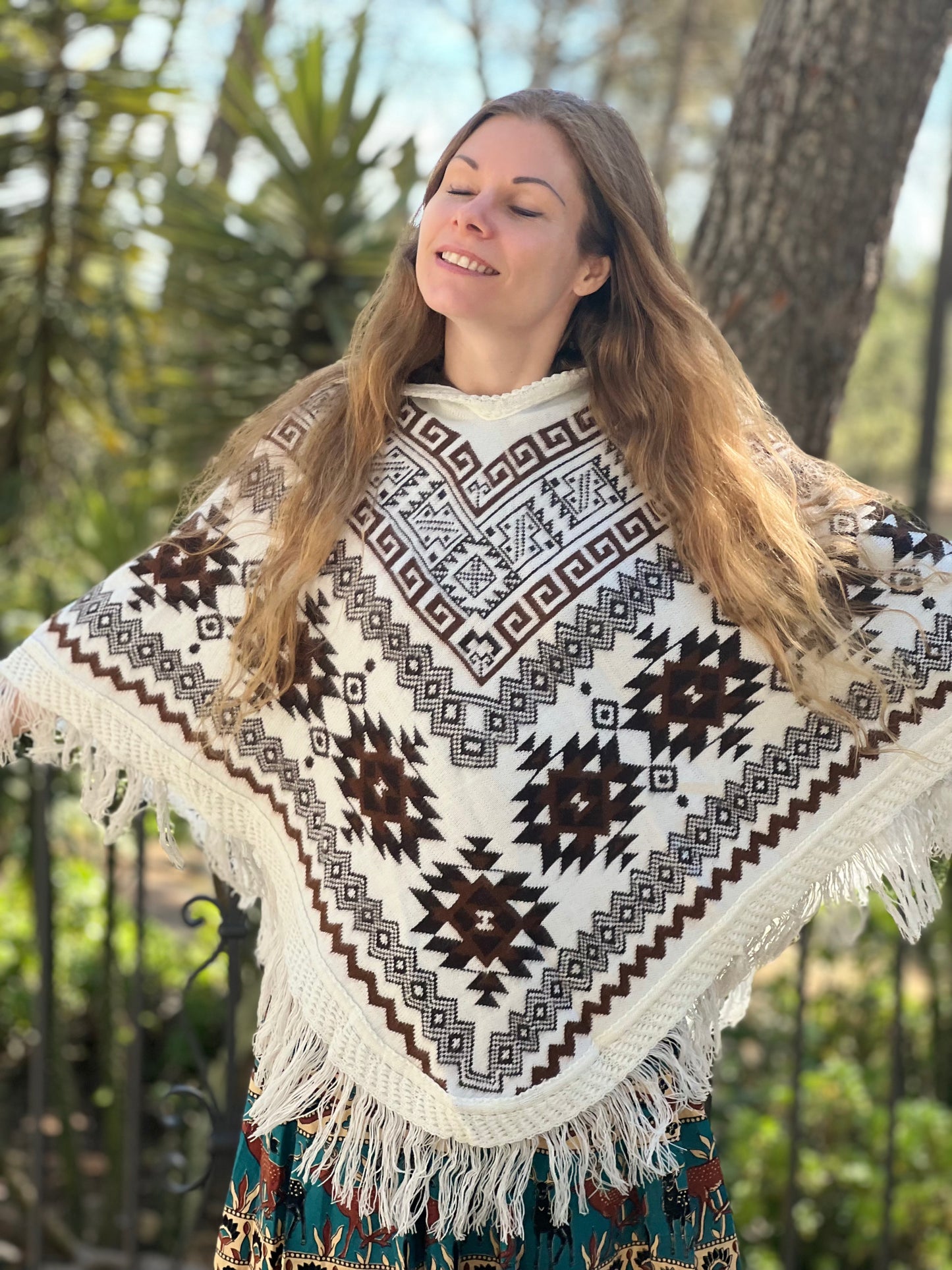 White winter poncho with brown patterns