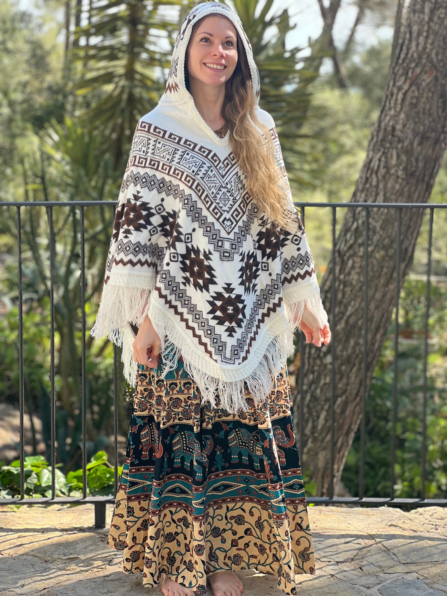 White winter poncho with brown patterns