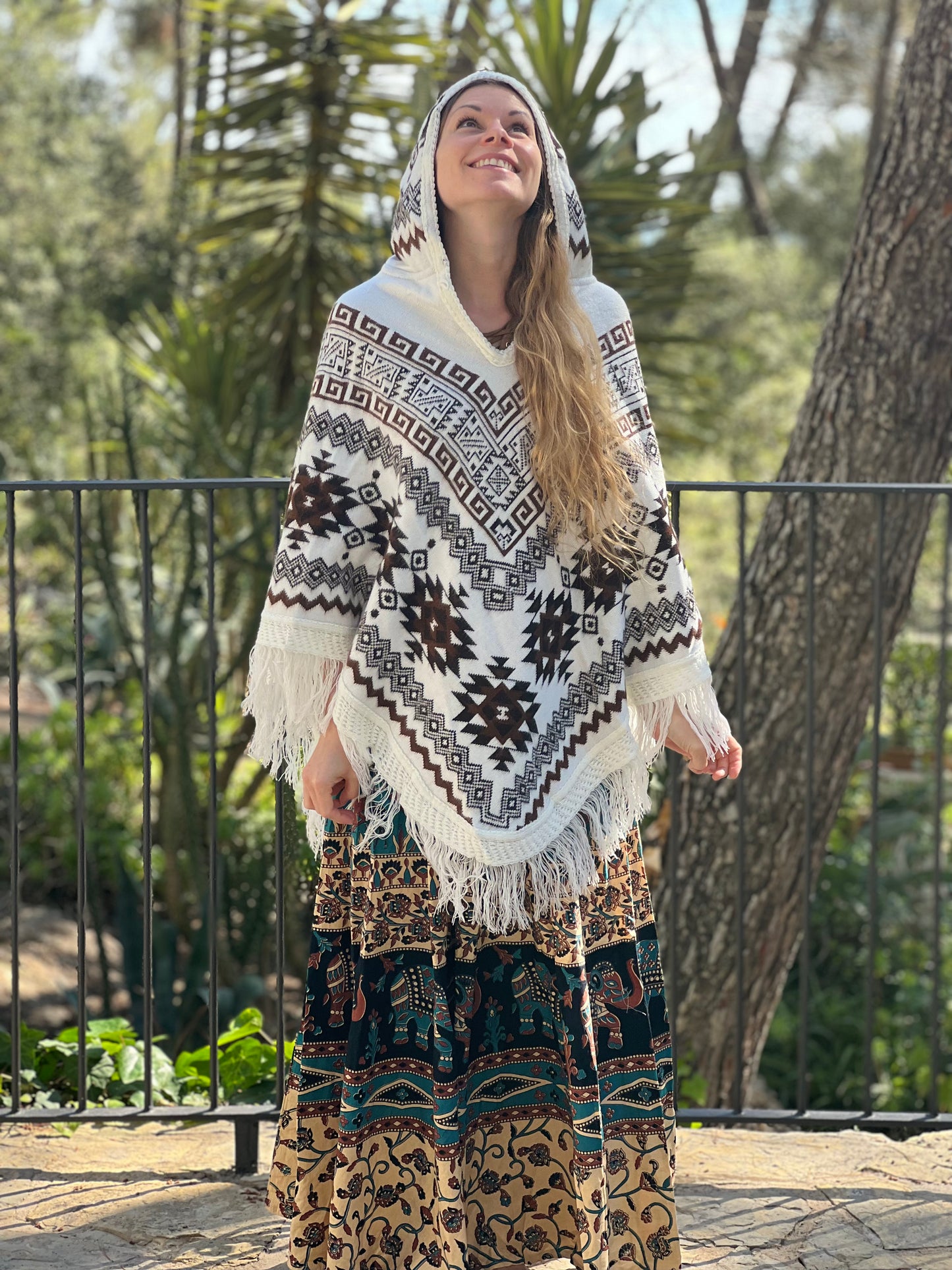 White winter poncho with brown patterns