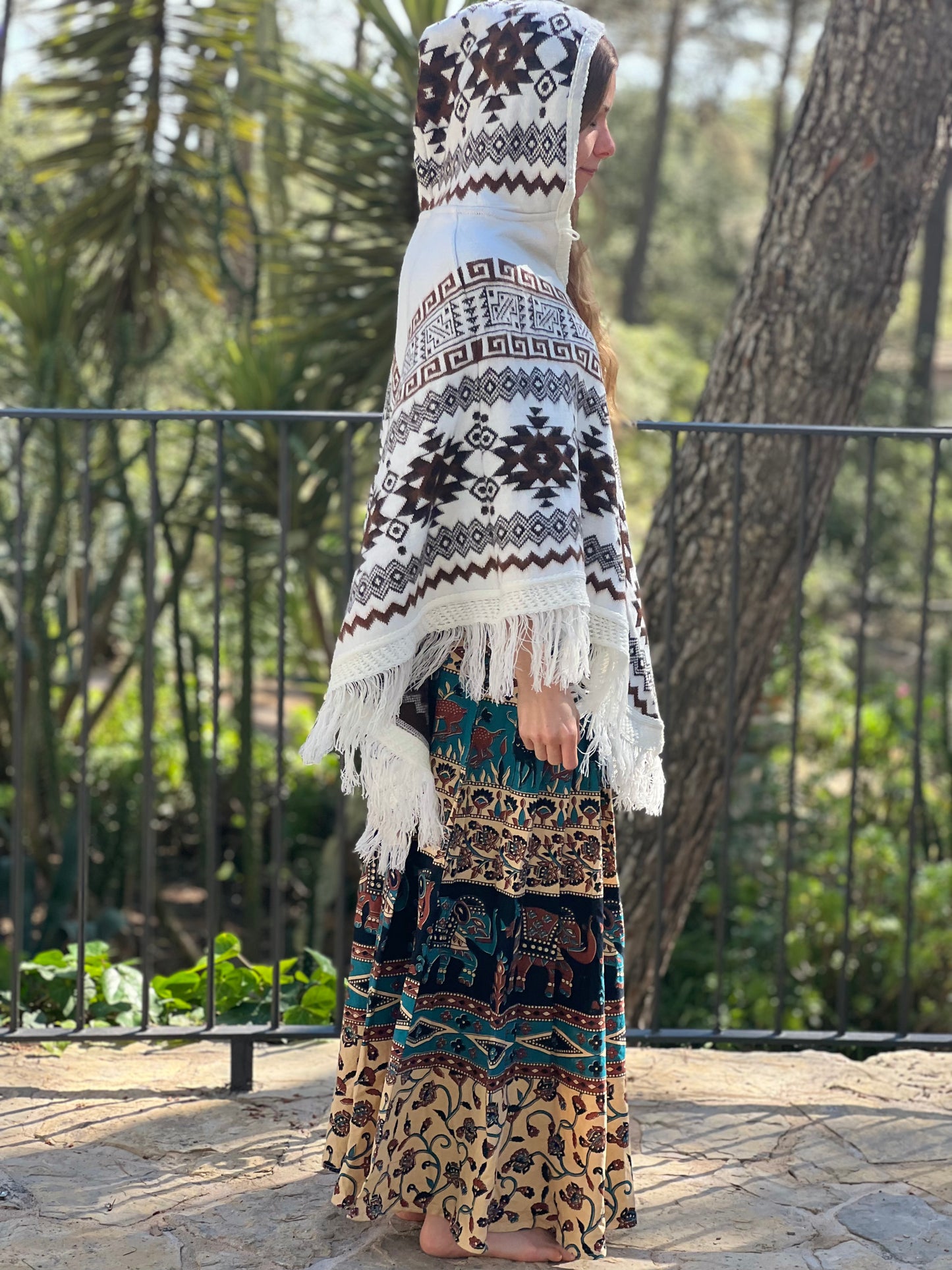 White winter poncho with brown patterns