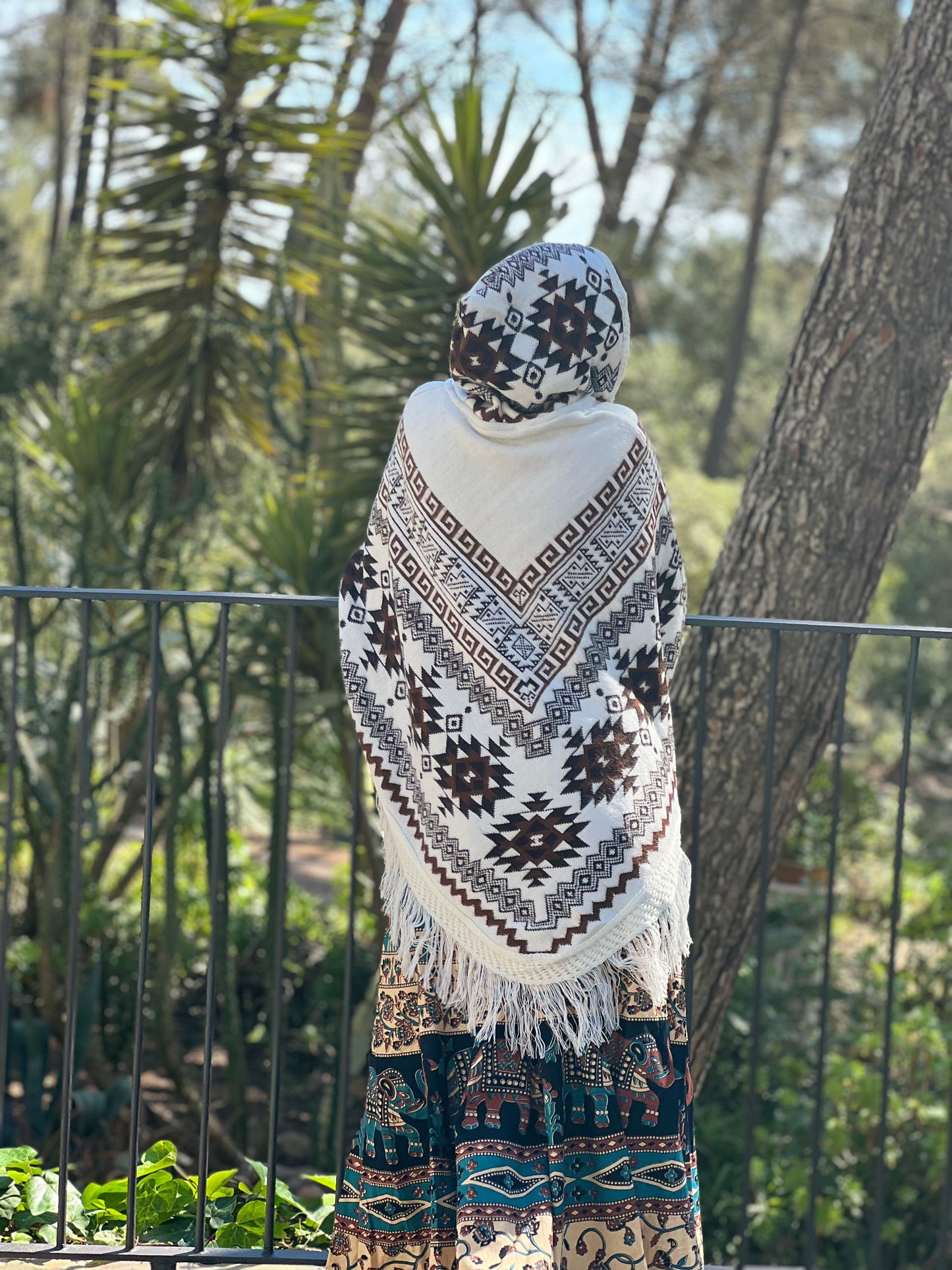 White winter poncho with brown patterns