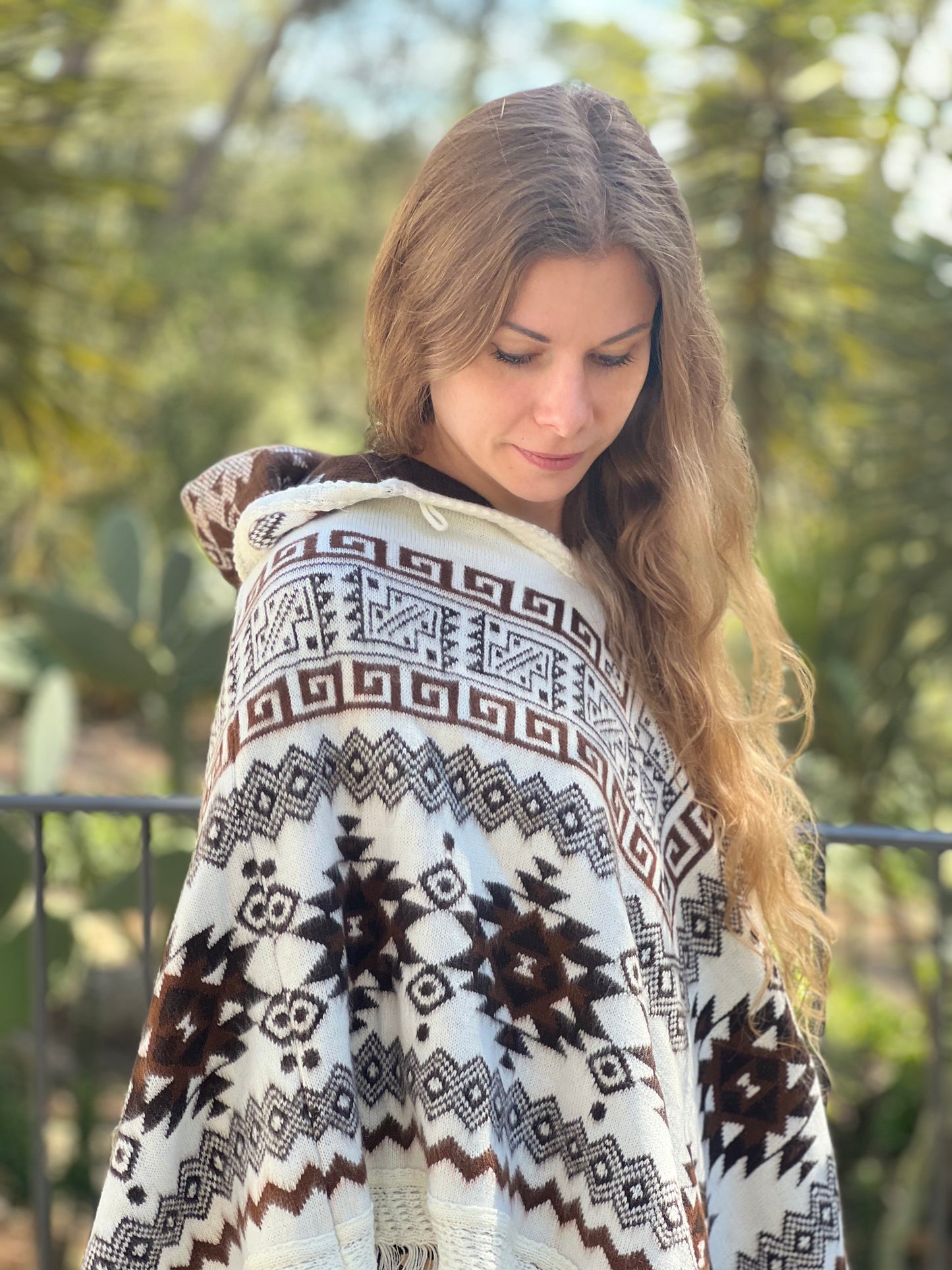 White winter poncho with brown patterns