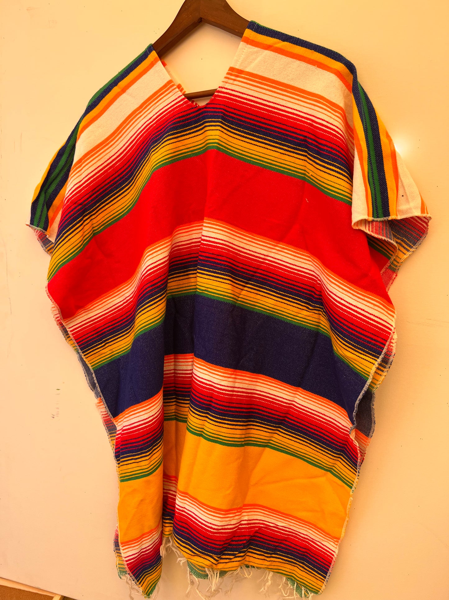 Rainbow coloured summer poncho