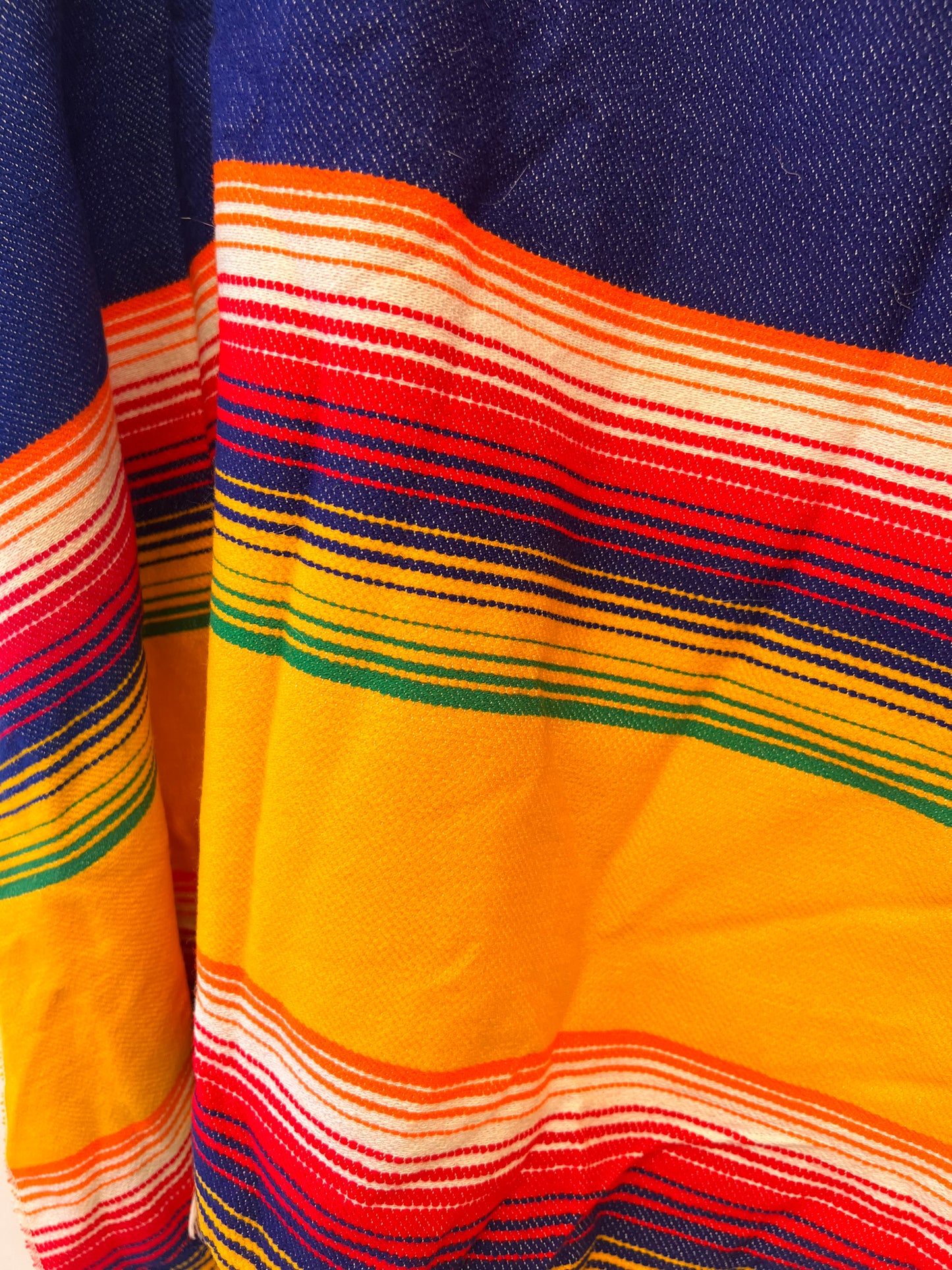 Rainbow coloured summer poncho