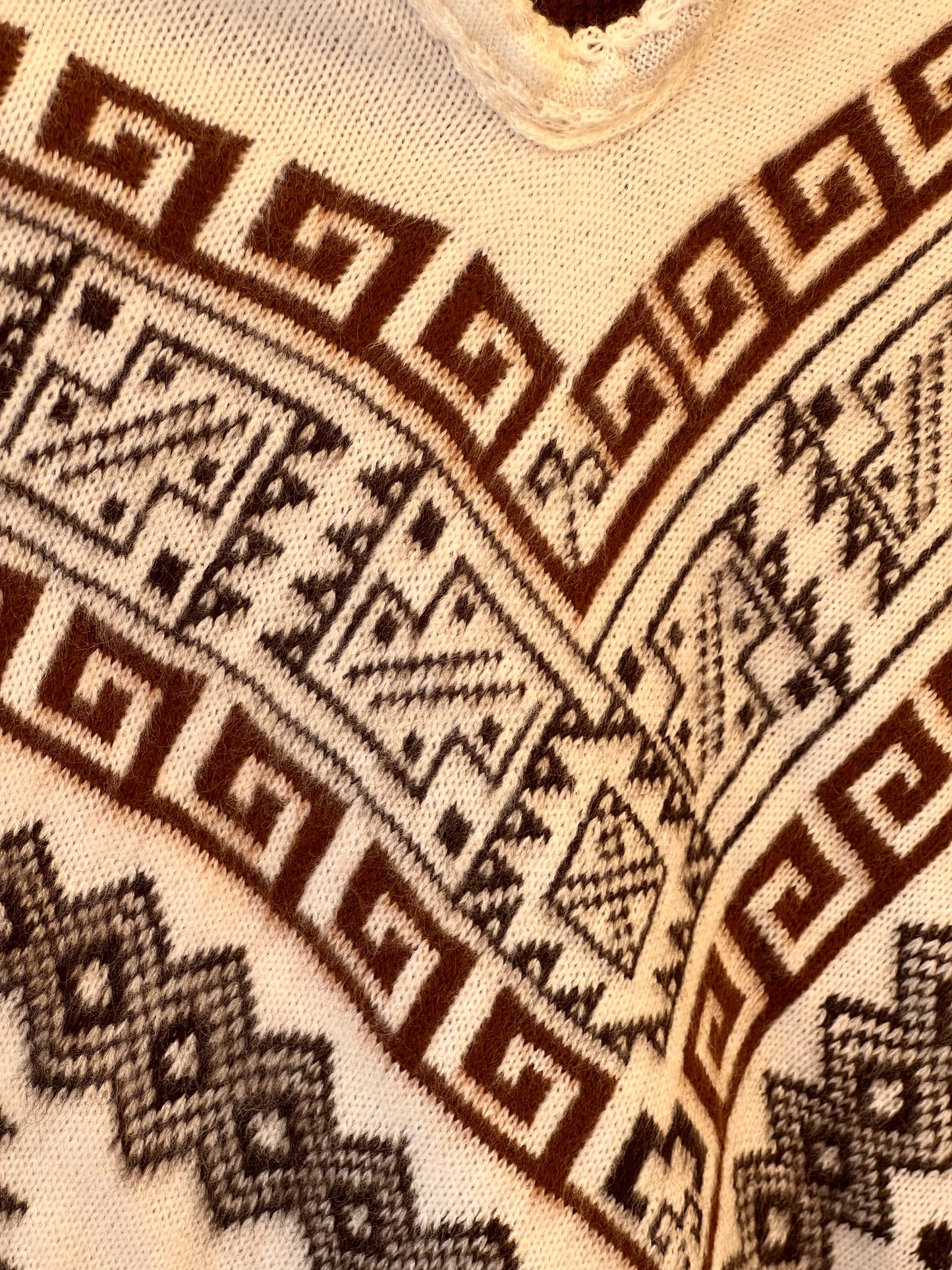 White winter poncho with brown patterns