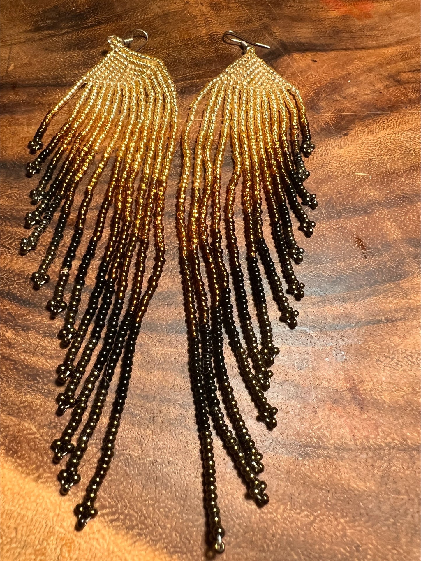 Long golden earth earrings