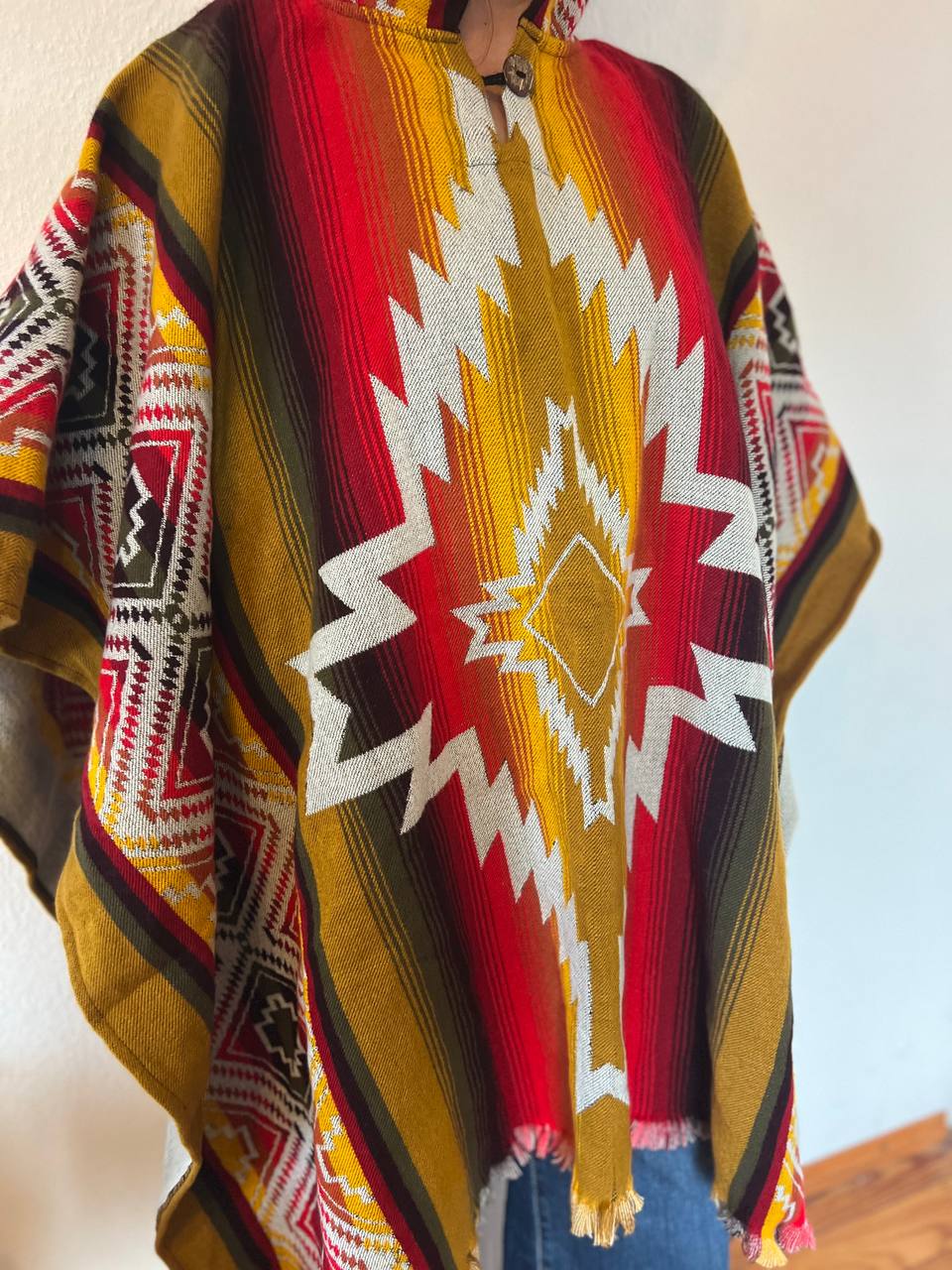 Red-beige and multicolour winter poncho