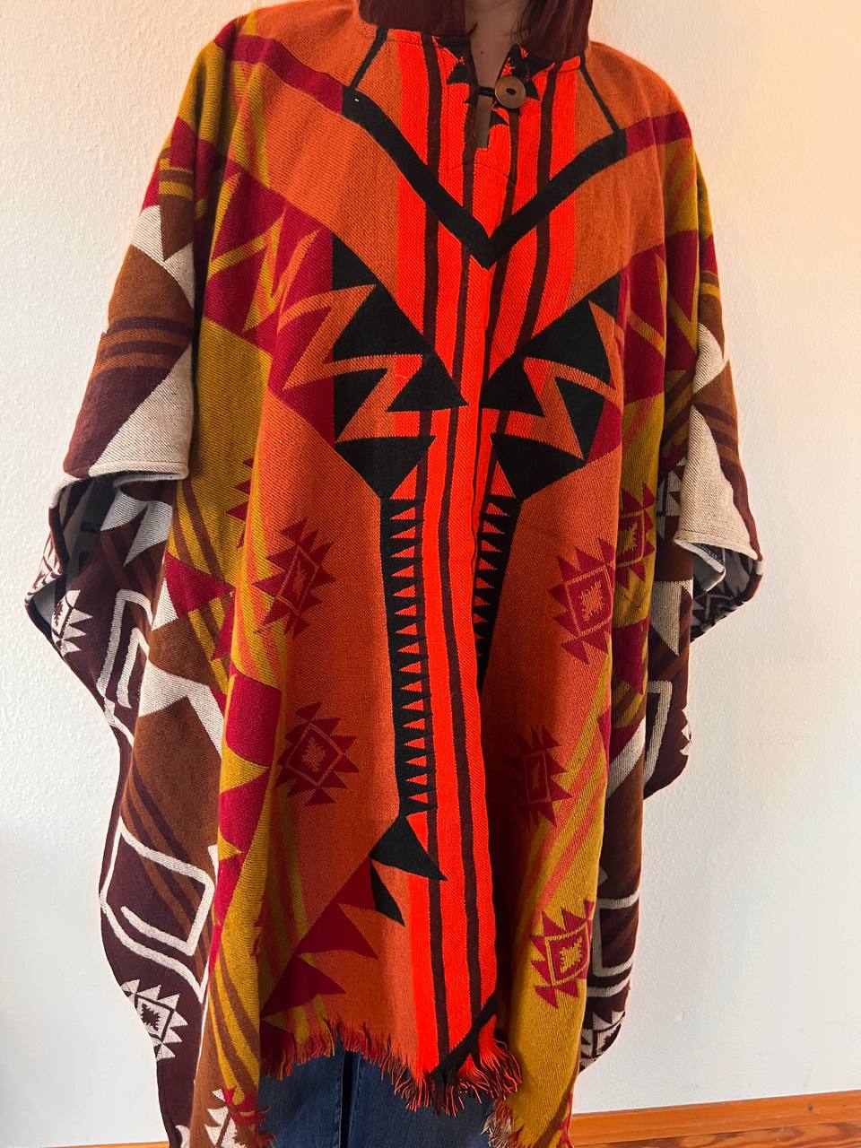 Red winter poncho with patterns