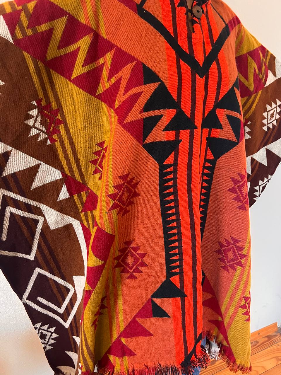 Red winter poncho with patterns