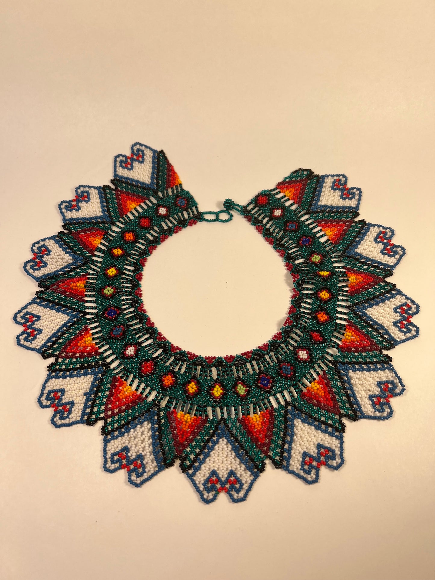 Dark green round necklace with colourful patterns - Yanacona