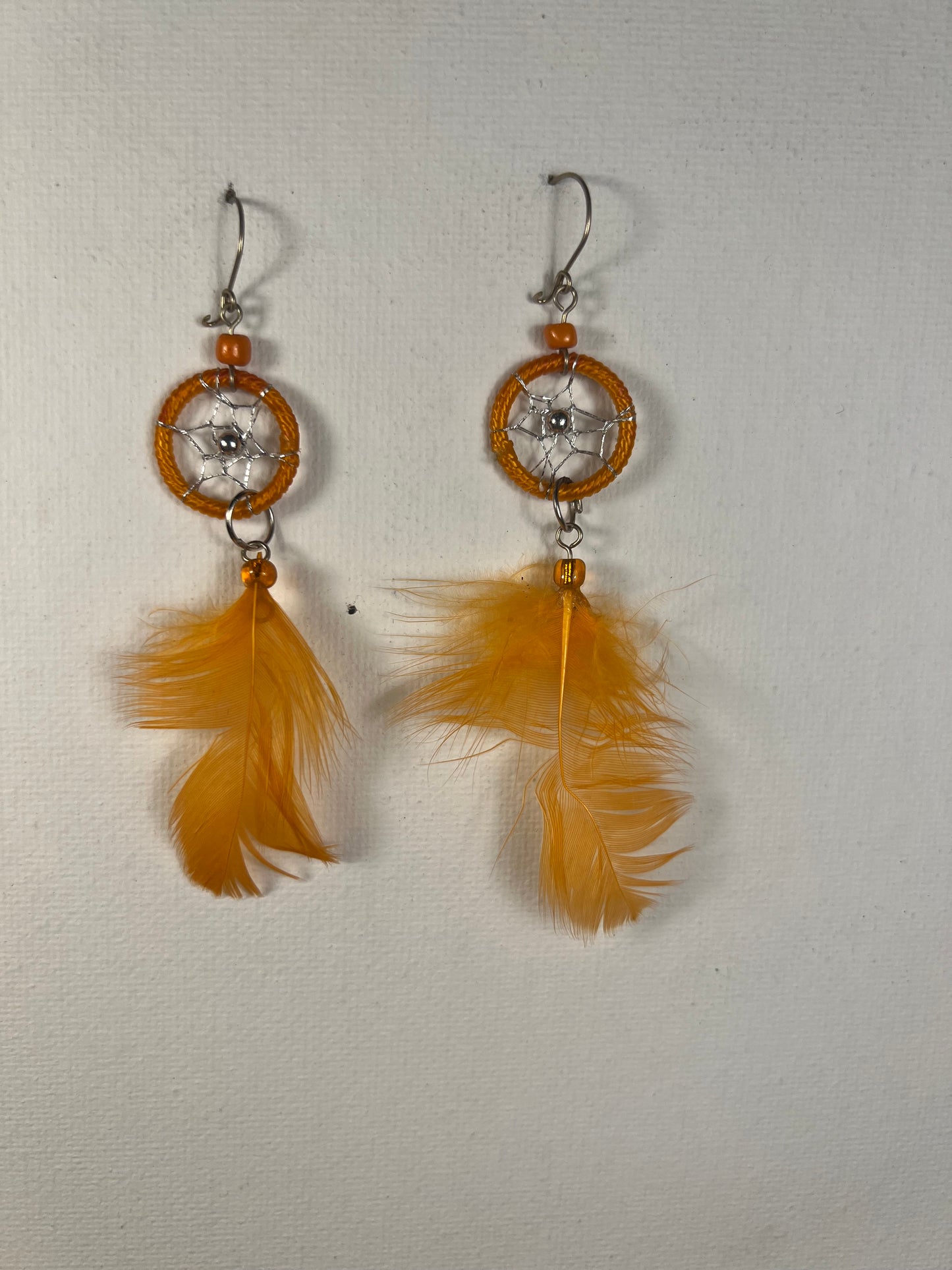 Orange feather earrings