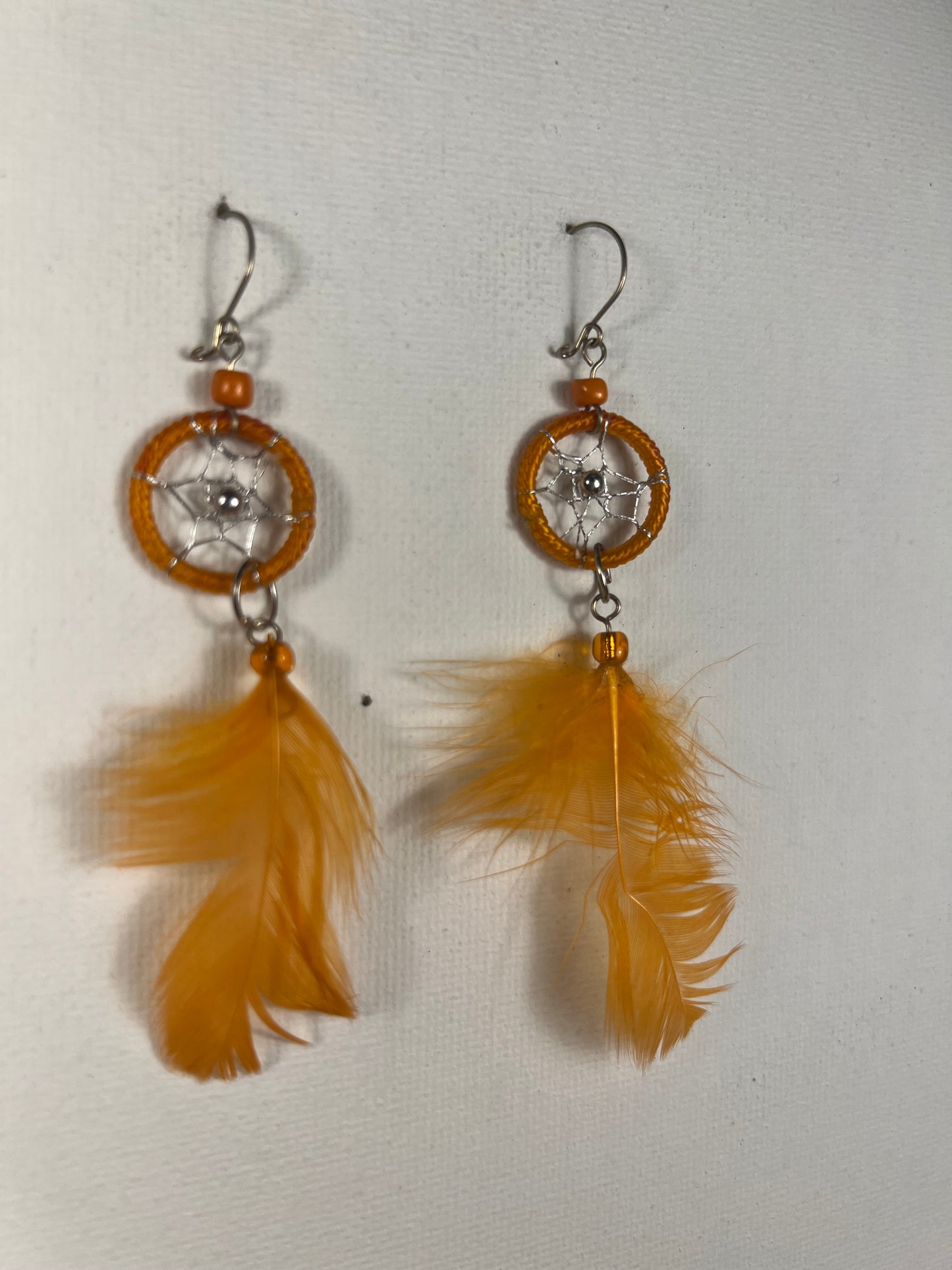 Orange feather earrings