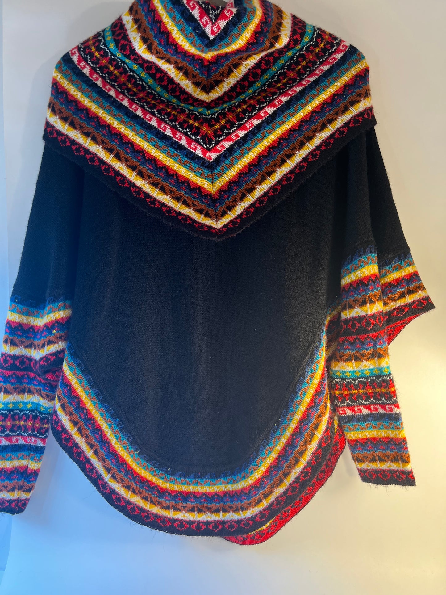 Black winter poncho sweater with multicoloured neack and sleeves