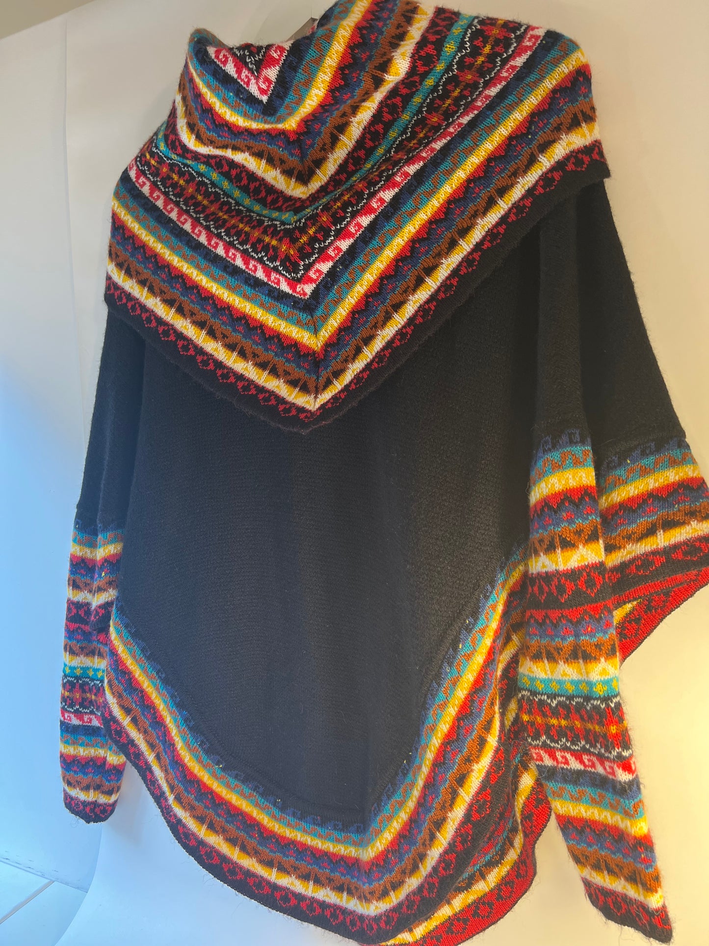 Black winter poncho sweater with multicoloured neack and sleeves